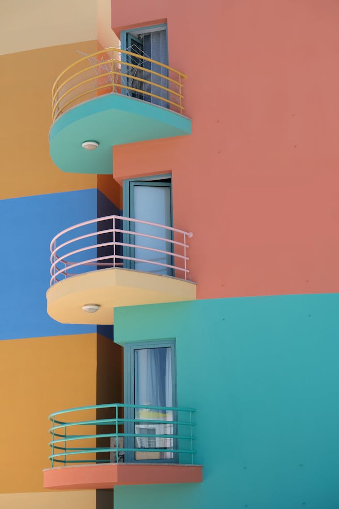 Bright colorful building with modern balconies in Portugal's vibrant architecture.